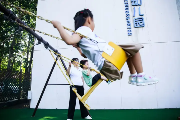Children enjoying the leafy kindy playground
